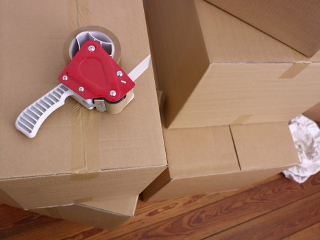 Packed office furniture and equipment ready for relocation in north London