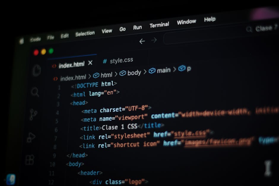 A close-up photograph of a computer screen displaying code in HTML, with visible tags such as '<code>', '<file>', '<role>', and '<button>', and the text 'Sign up today' in the code snippet. The image